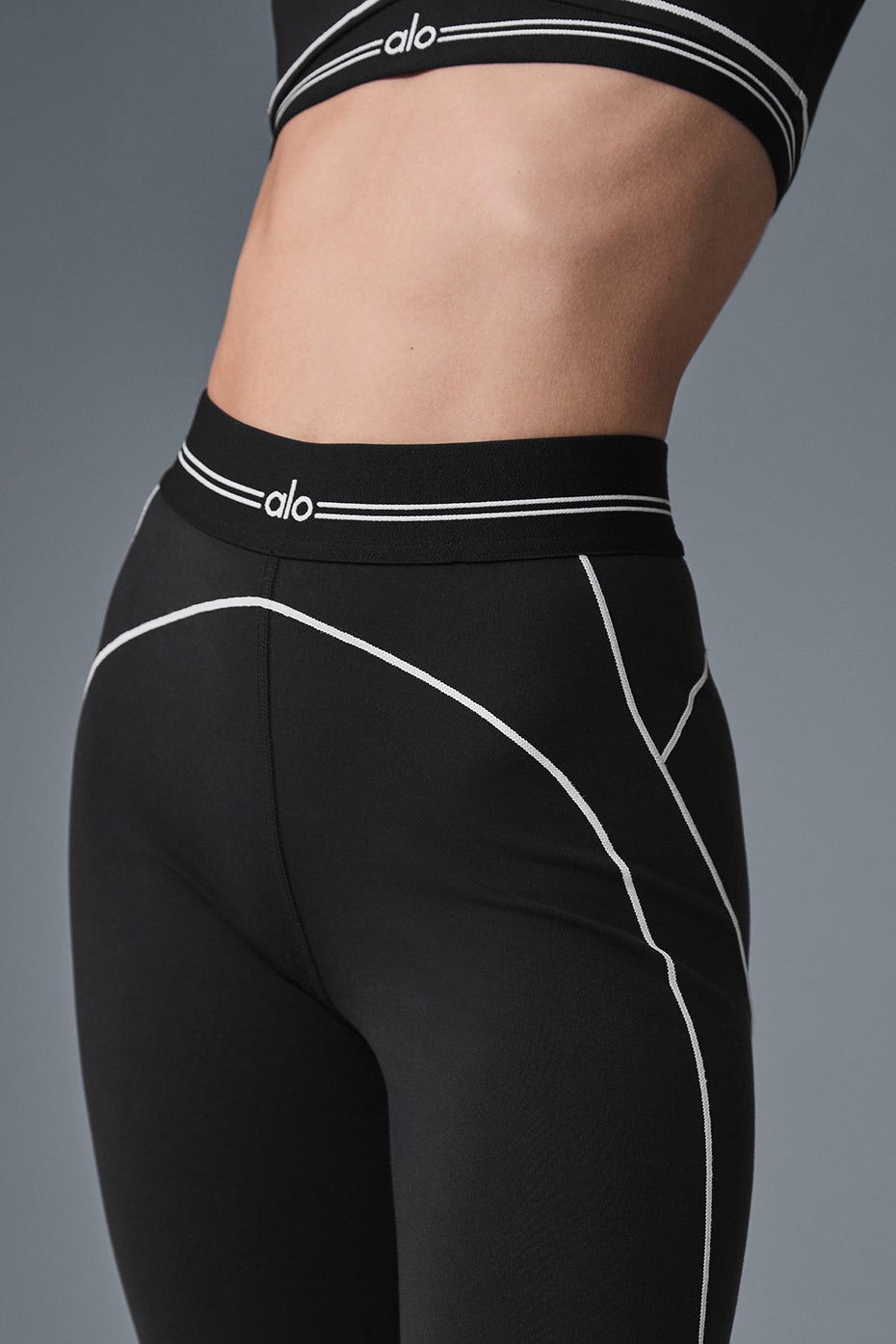Model wearing Heart Throb high-waisted leggings with a matching Airbrush bra.