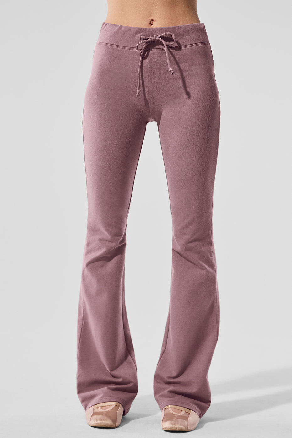 Model wearing Sway bootcut sweatpants for casual outings.