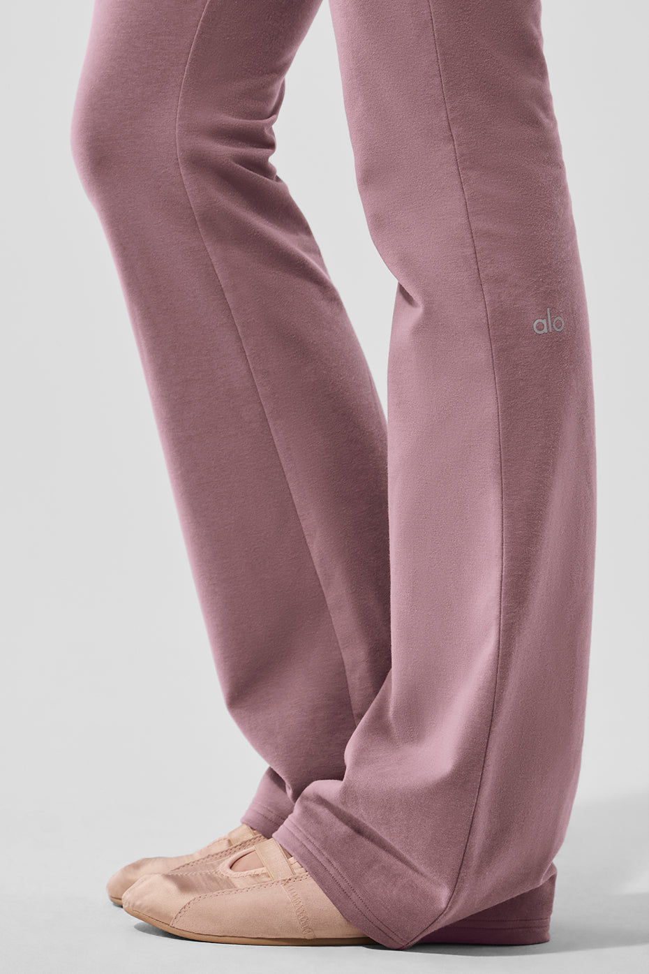 Side angle showing the fitted design of the bootcut sweatpants.