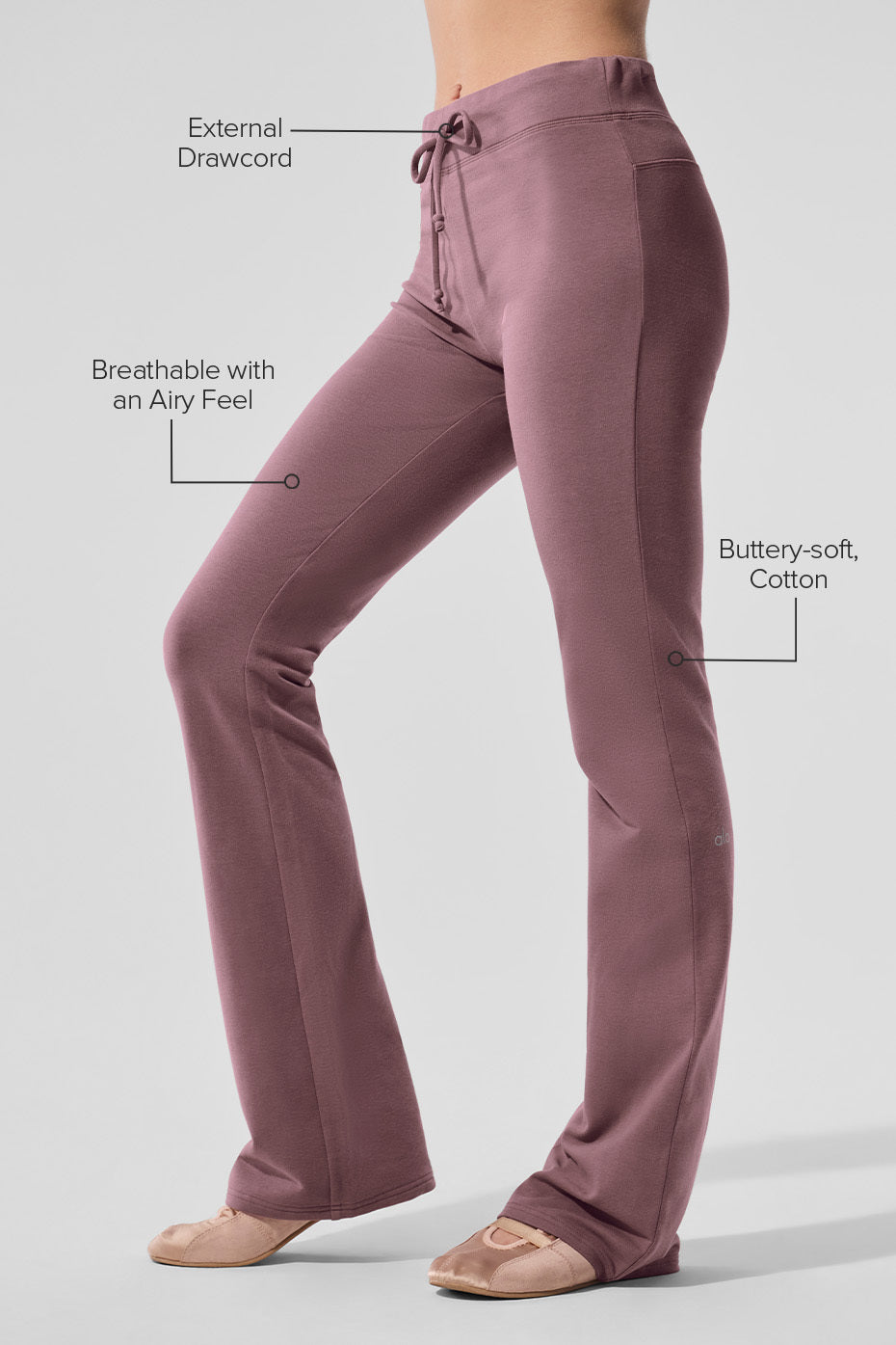 Side angle showing the fitted design of the bootcut sweatpants.