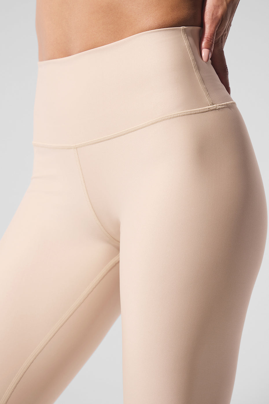 Front view of Airlift high-waisted leggings in Macadamia, showcasing the sleek design.