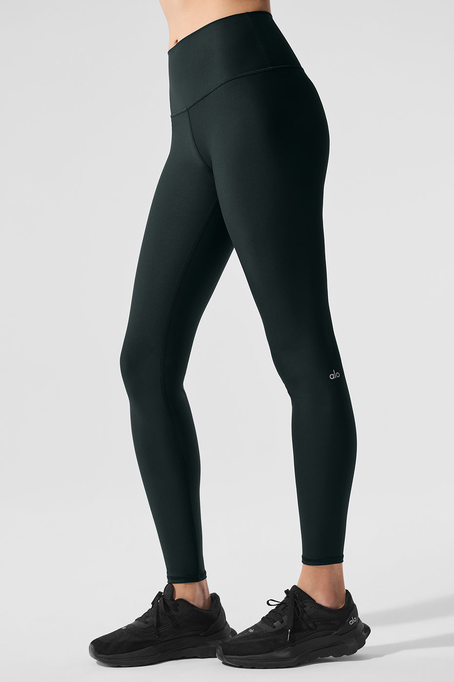 Side view of compression leggings showing the four-way stretch fabric.