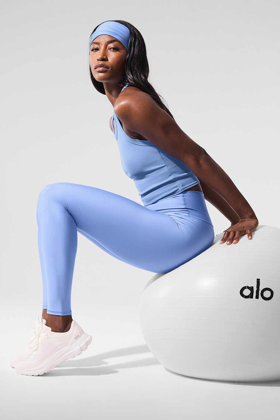 Side view of compression leggings highlighting the double-layered waistband and ankle length.