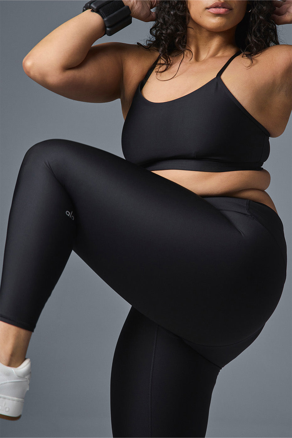 Front view of black high-waist Airlift leggings, showcasing the sculpting fit.