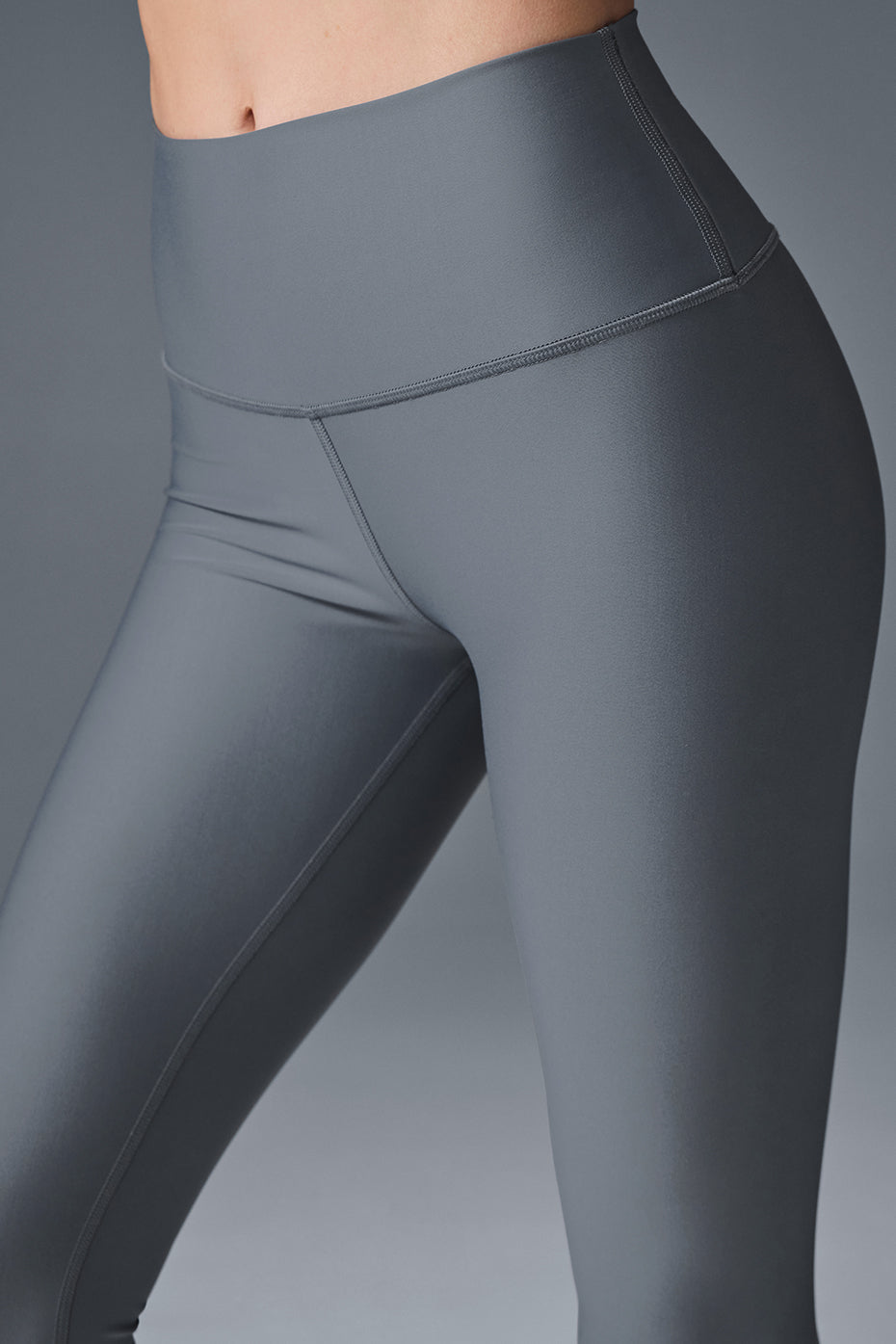 Back angle of 7/8 Airlift leggings showing high-rise waist and ankle hem