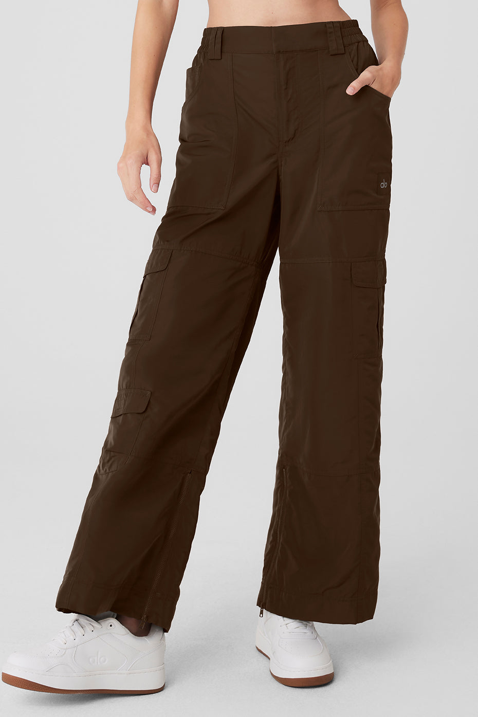 Front view of women’s high-waist ski pants with cargo pockets in espresso, perfect for cold weather adventures