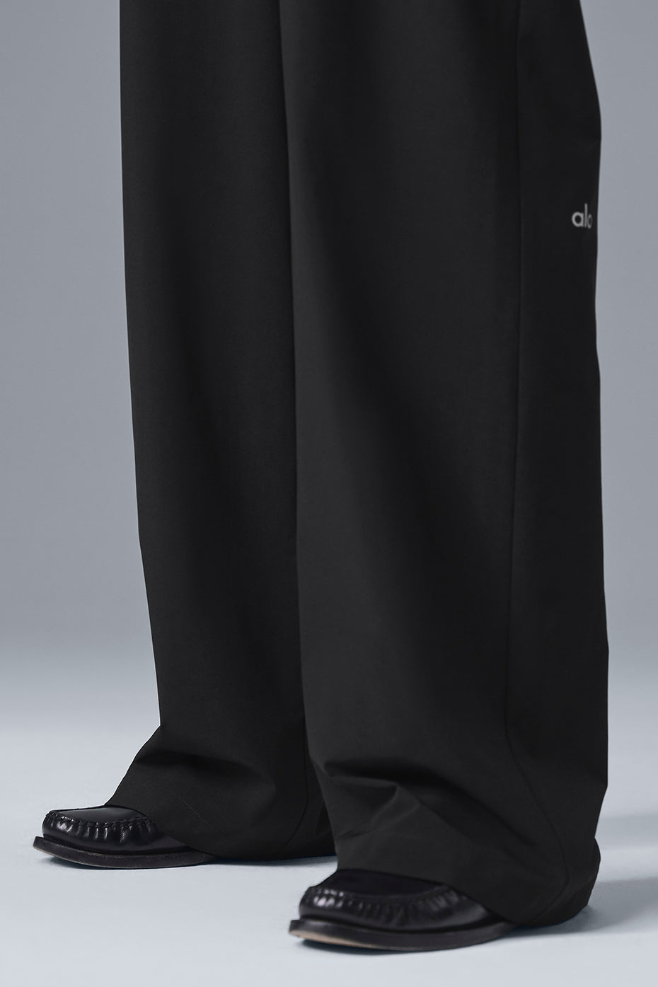 Side view of Elevate High-Waist Trousers showcased in a relaxed fit.