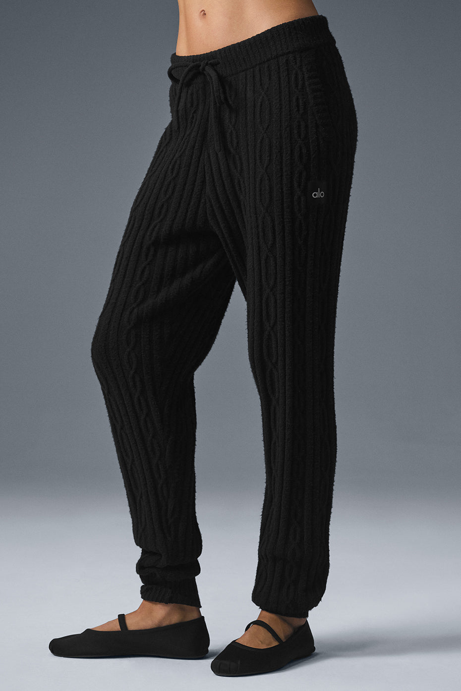 Men's cozy cable knit winter pants shown with a relaxed fit and stretchy cuffs, ideal for cold weather
