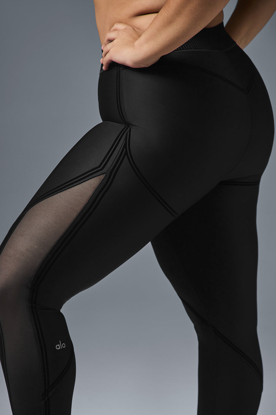 Front view of black mesh leggings showcasing stylish design.