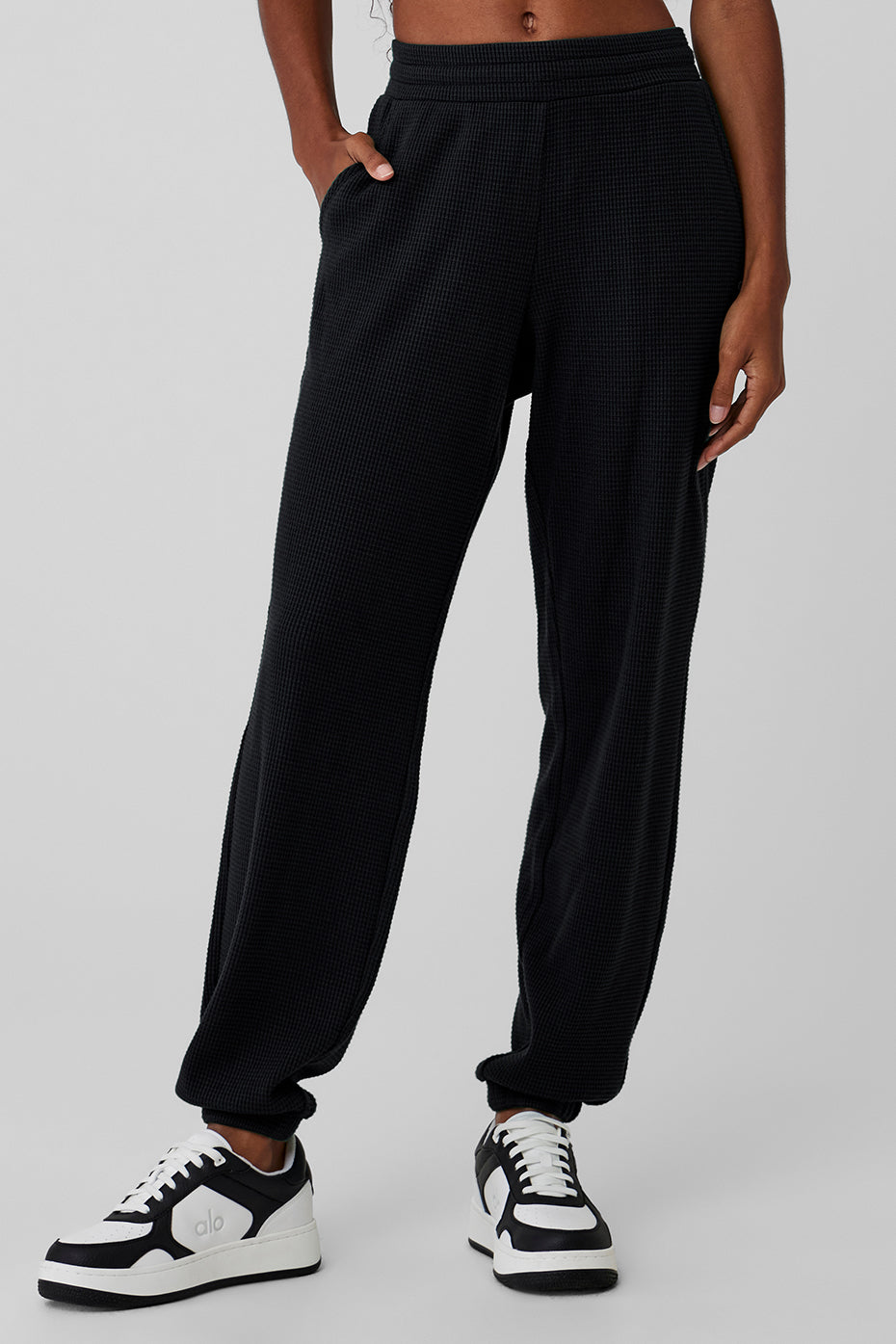 Close-up of waffle knit texture on black lounge pants