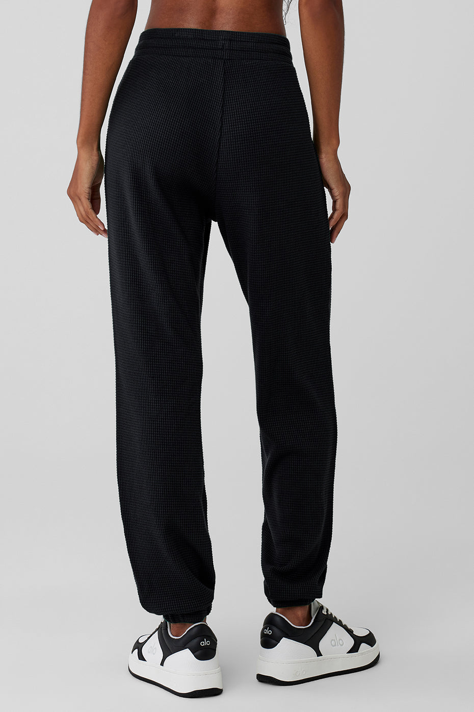 Detail shot of stretchy waistband and ankle cuffs on waffle joggers