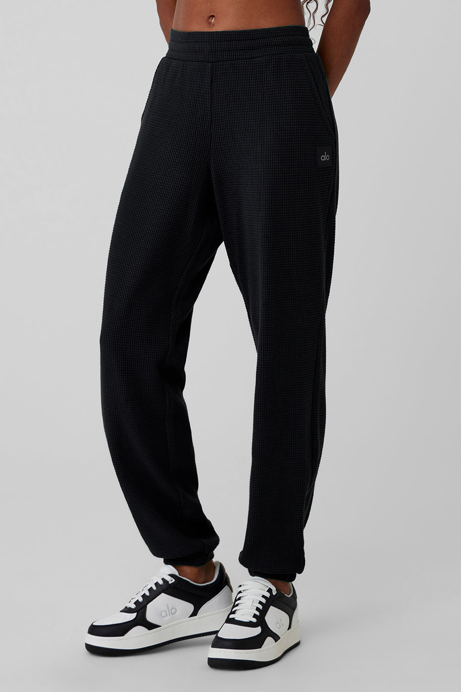 Close-up of waffle knit texture on black lounge pants