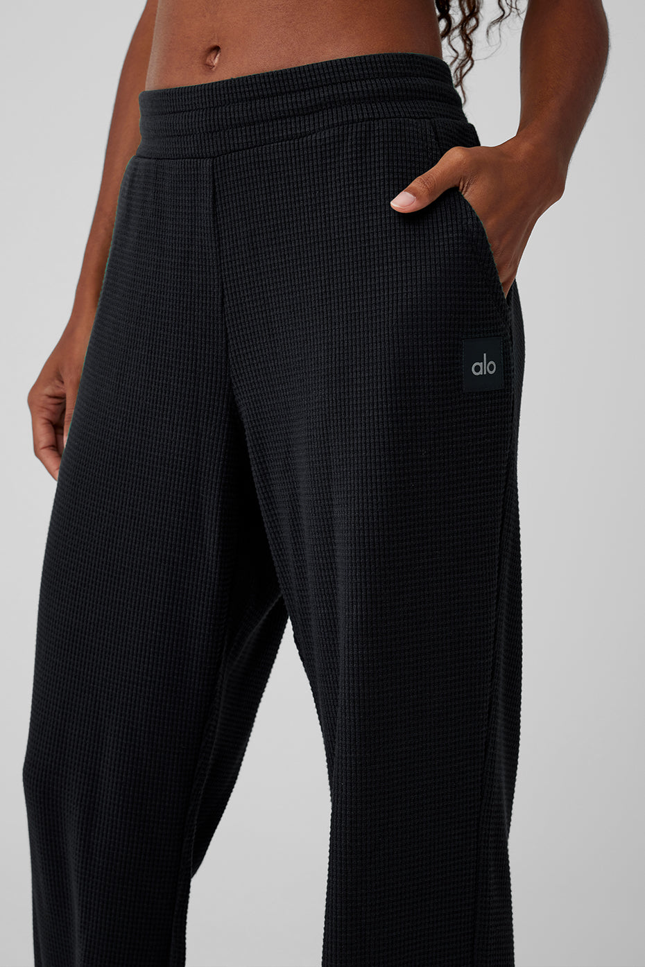 Front and back view of model wearing lounge pants black