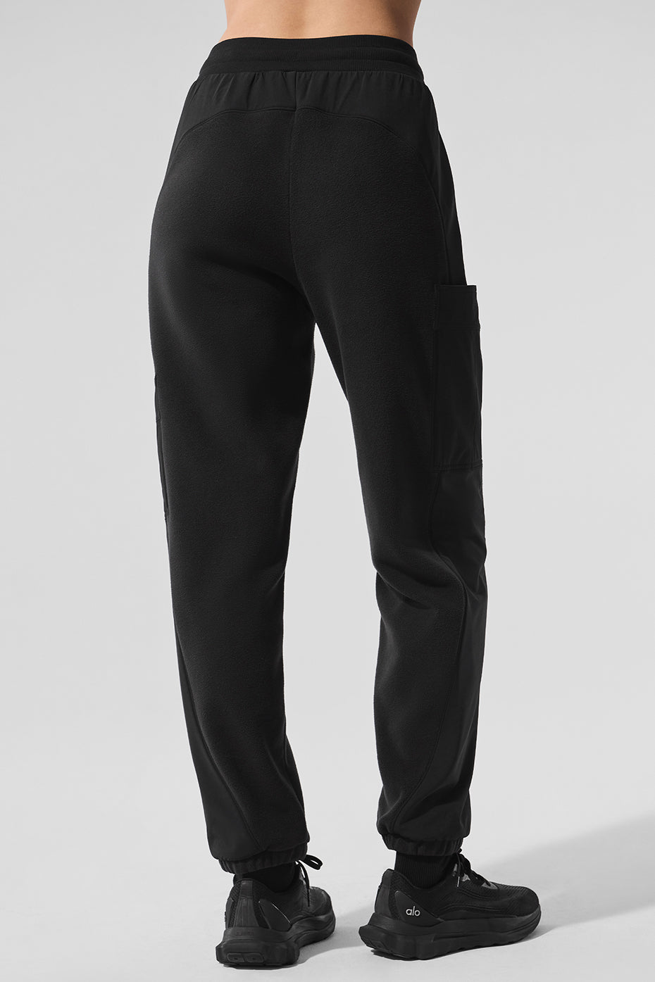Side view showcasing the pockets of the fleece lined pants.