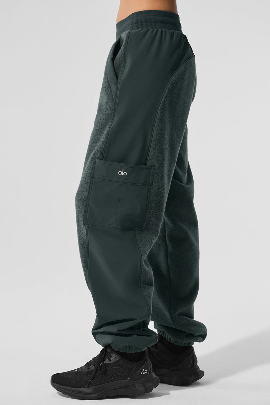 Pair of cozy fleece-lined jogger pants on a model outdoors in winter