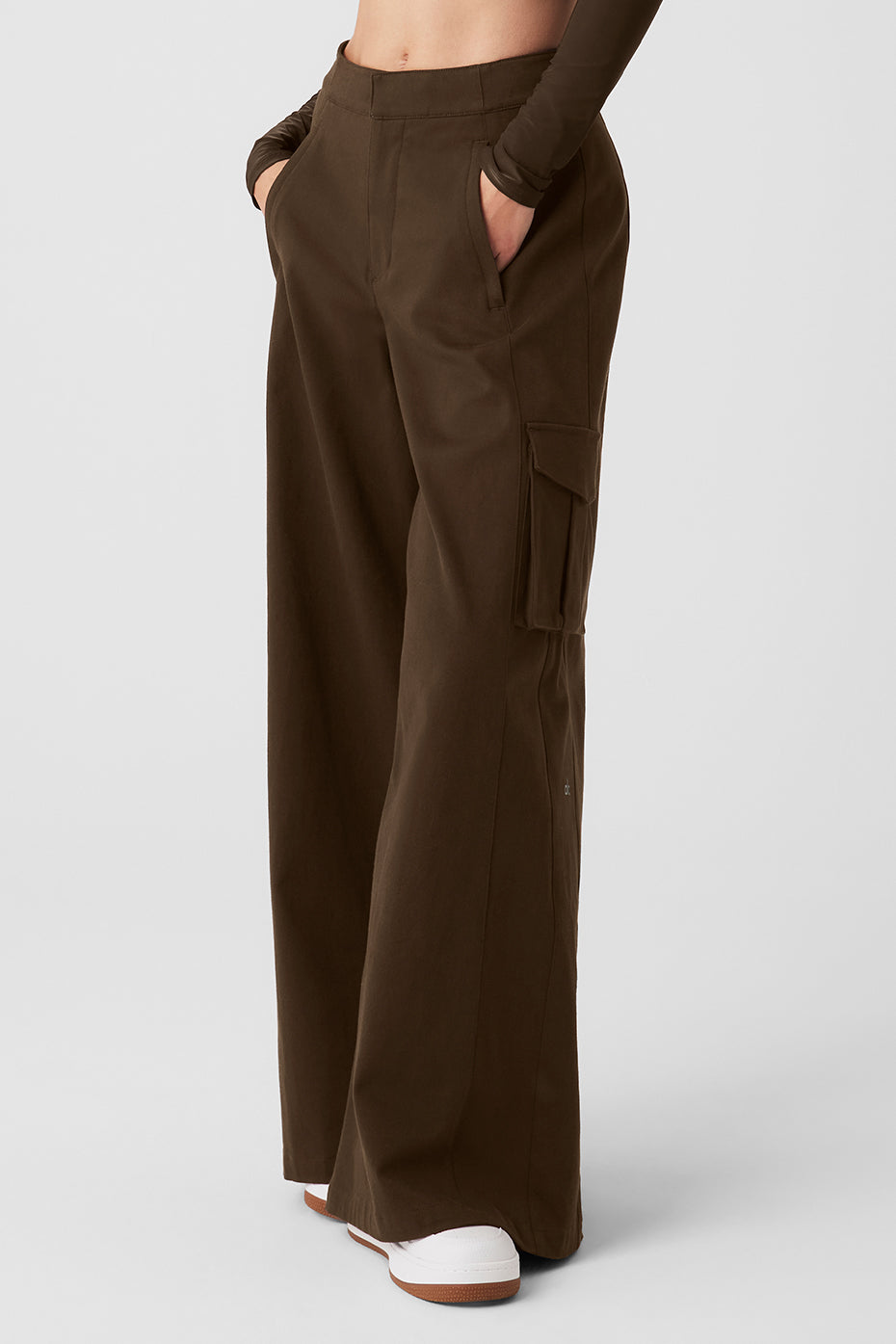 Close-up of cargo pockets and zipper details on wide leg trousers
