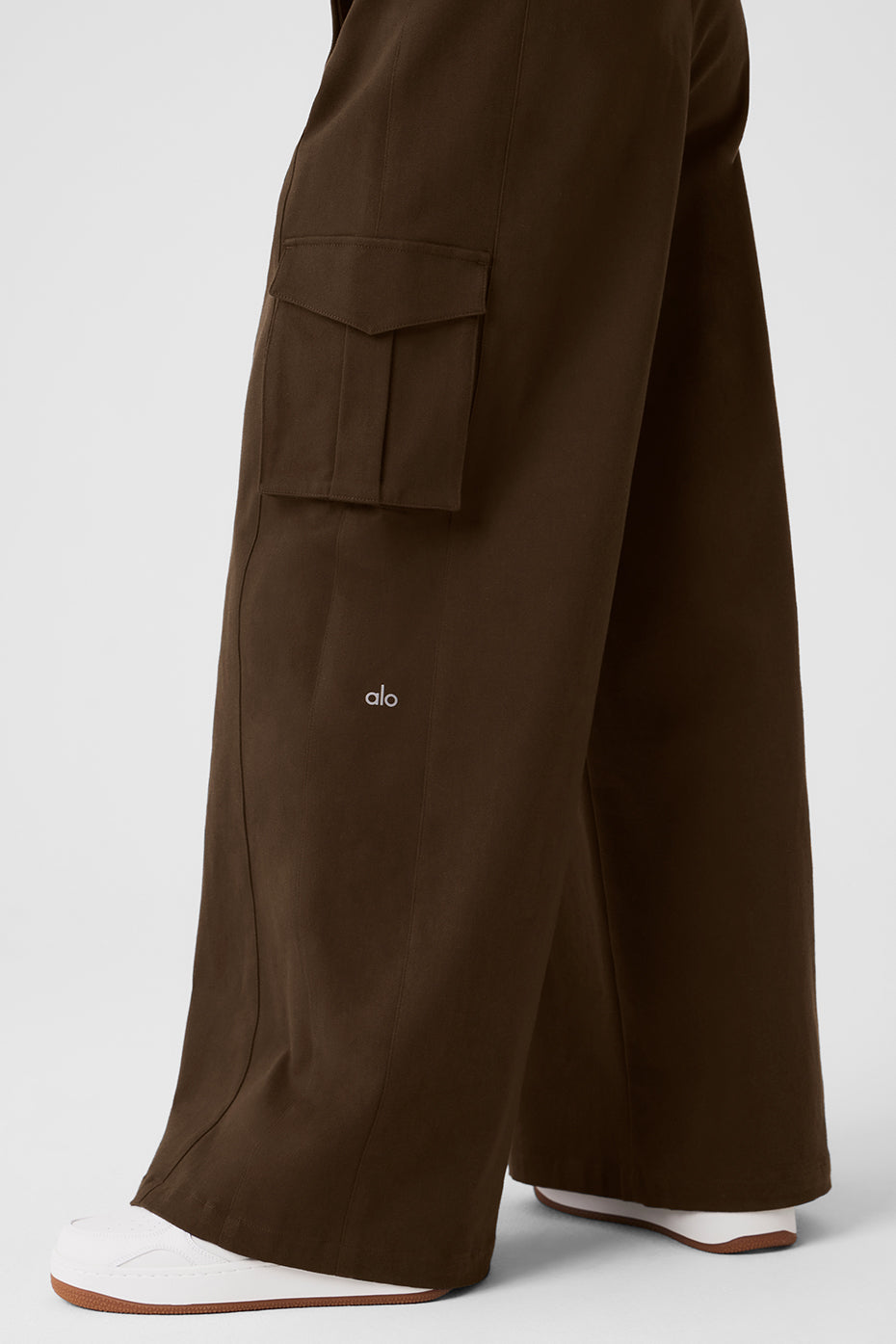 Front view of wide leg cargo trousers with exaggerated silhouette and cargo pockets