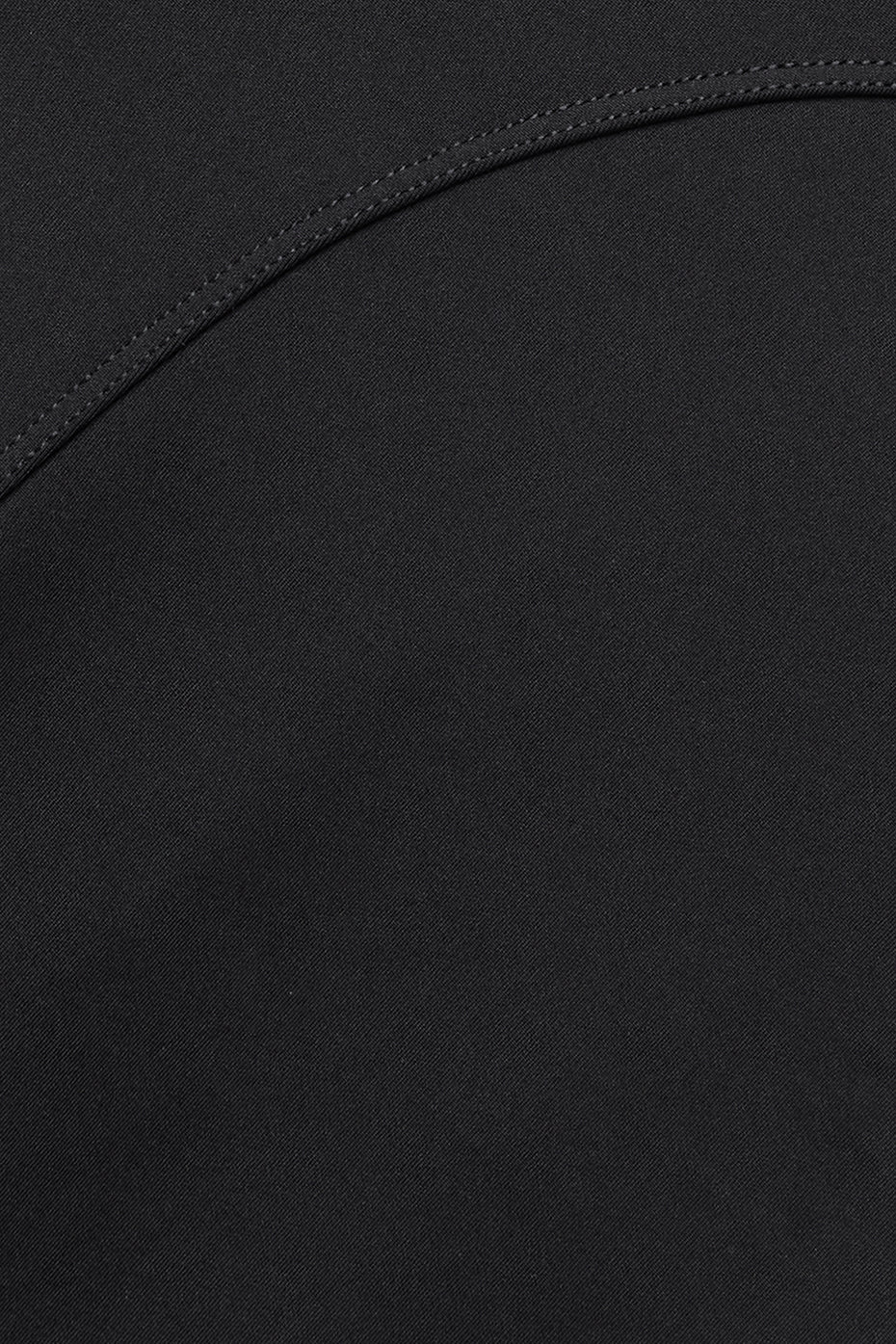 Side view showcasing the contoured seaming of the black workout leggings.