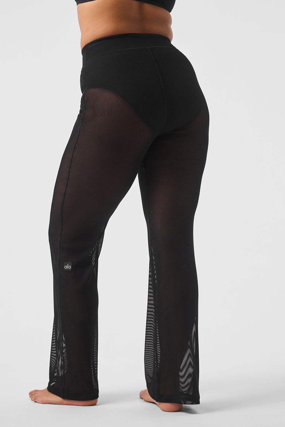 Close-up of striped mesh fabric texture on tropical nights pants