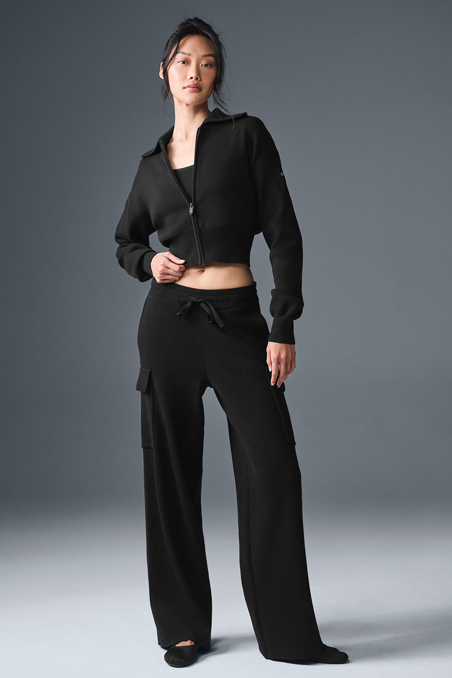 Casual outfit featuring black cargo pants and a trendy puffer jacket.