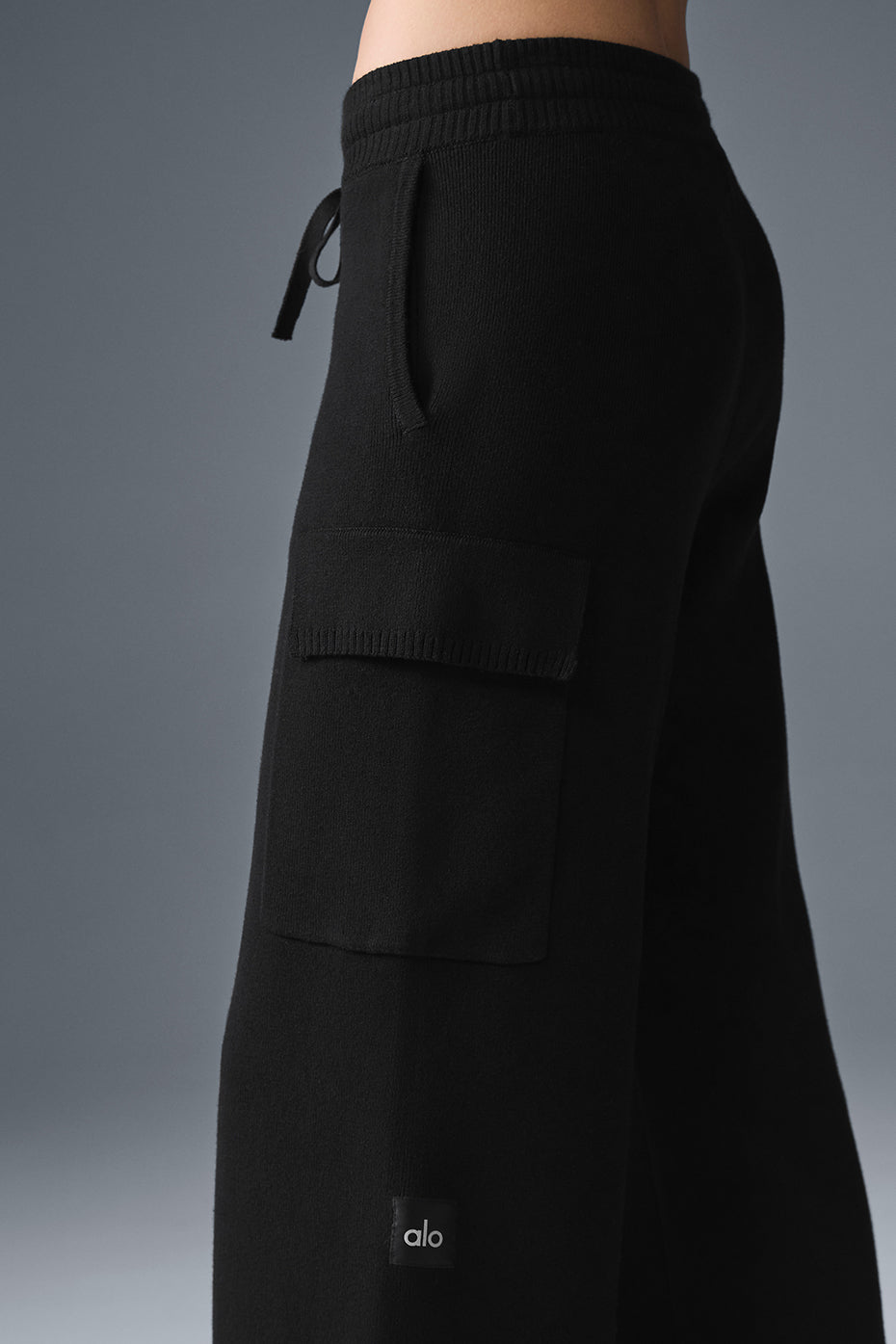 Side angle of womens cargo pants showcasing stylish pockets.