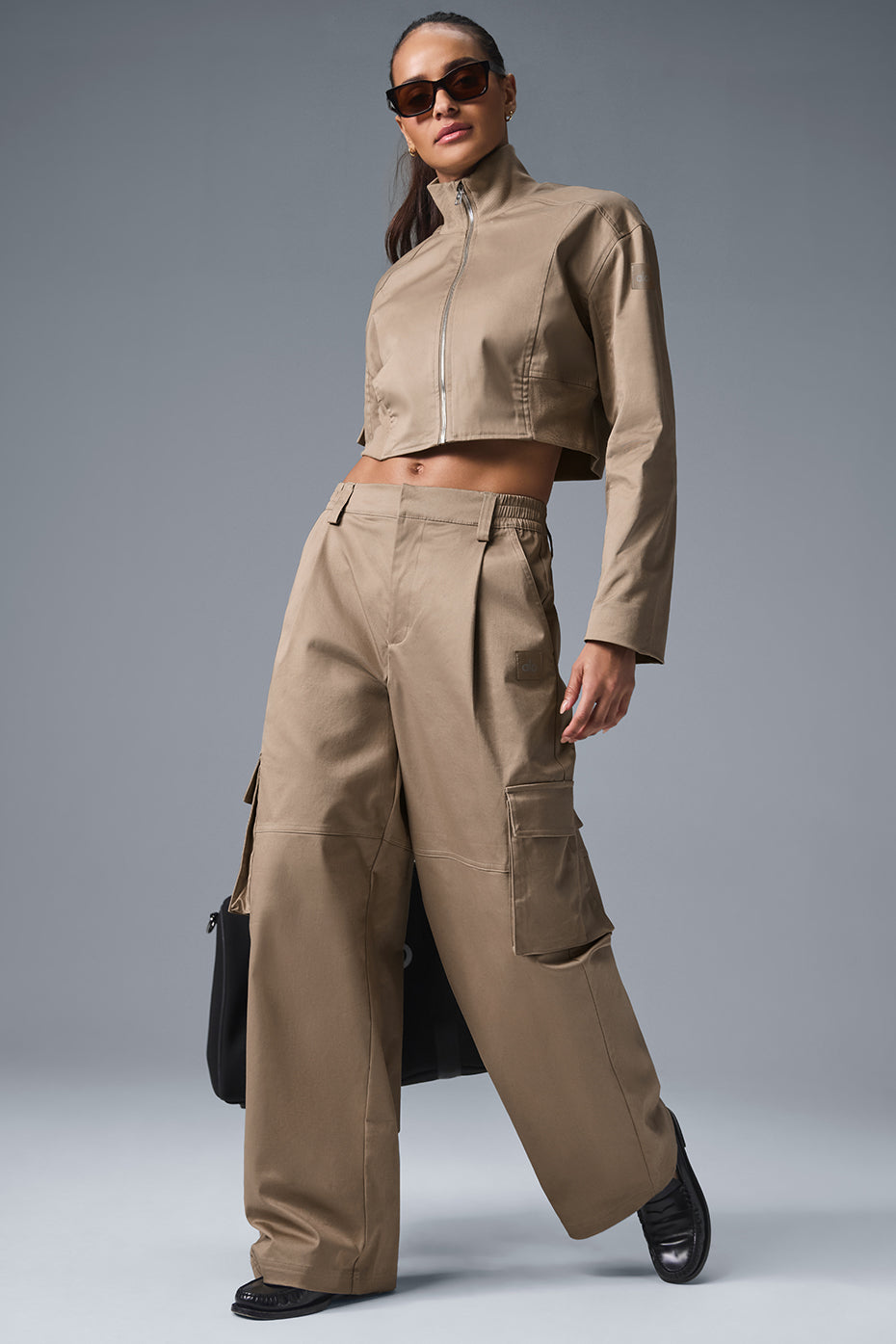 Front view of women's high waist cargo trousers with oversized pockets