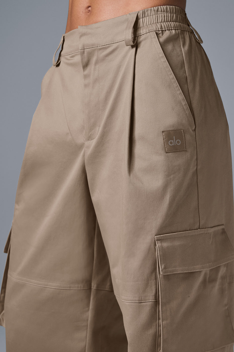 Front view of womens high waist cargo trousers with oversized pockets