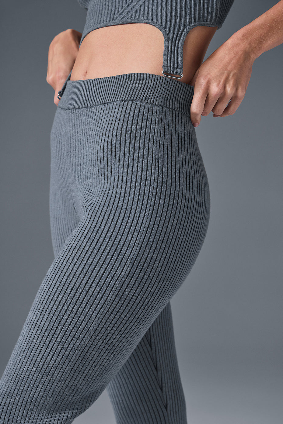Front view of steel grey flare pants women style with ribbed knit texture