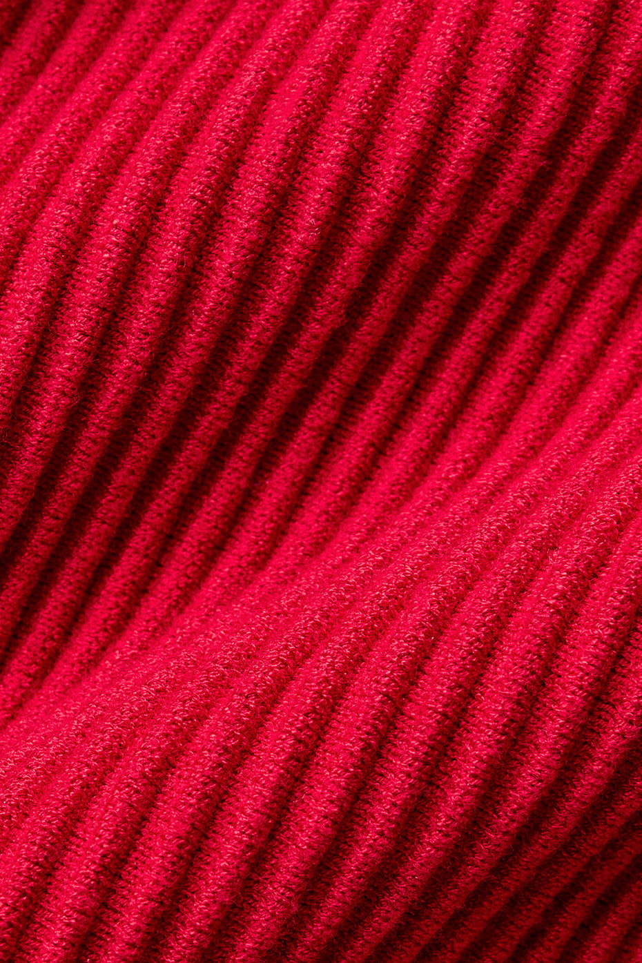 Back view highlighting the fit of ribbed knit flare pants.