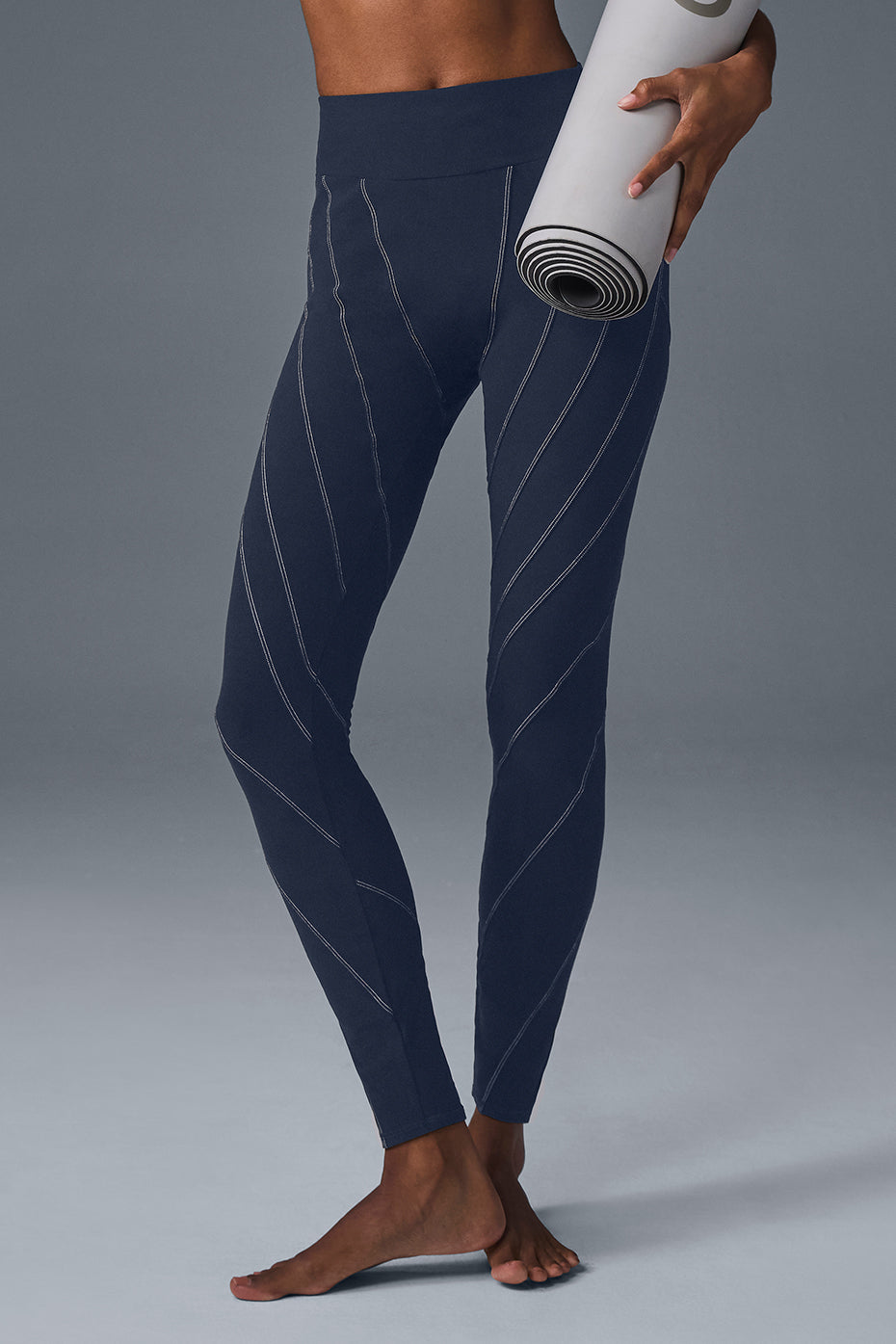 Front view of Alosoft high-waisted yoga leggings in navy/ivory.