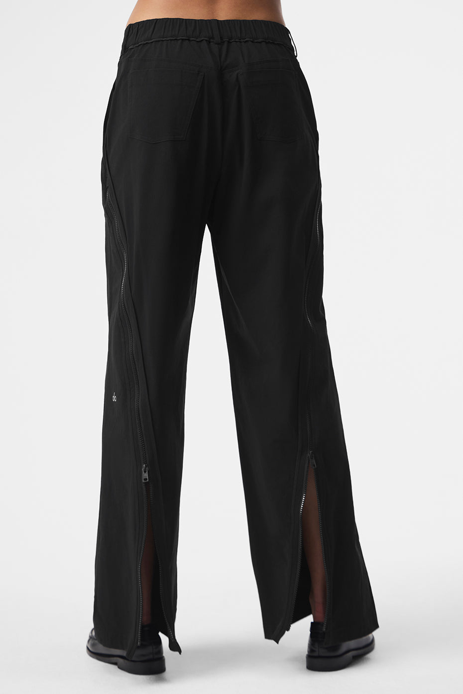 Styled image of mens black trousers paired with a smart casual shirt
