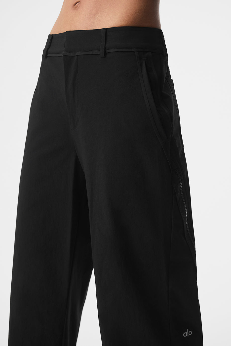 Front view of tailored mens black trousers with contrast trimming and zipper detail
