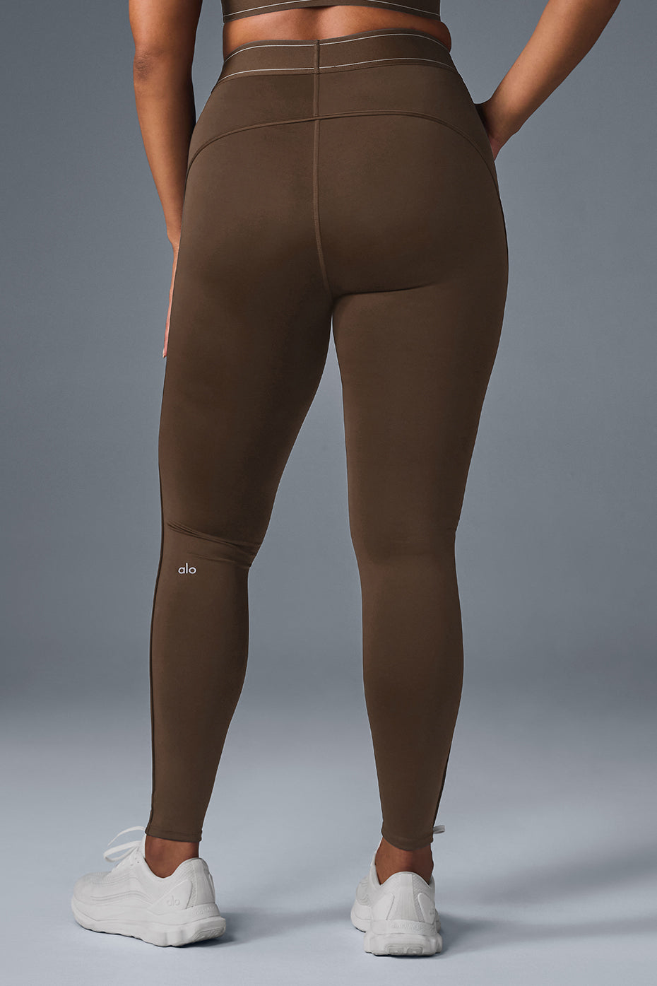 Back view highlighting the body-contouring design of the leggings.