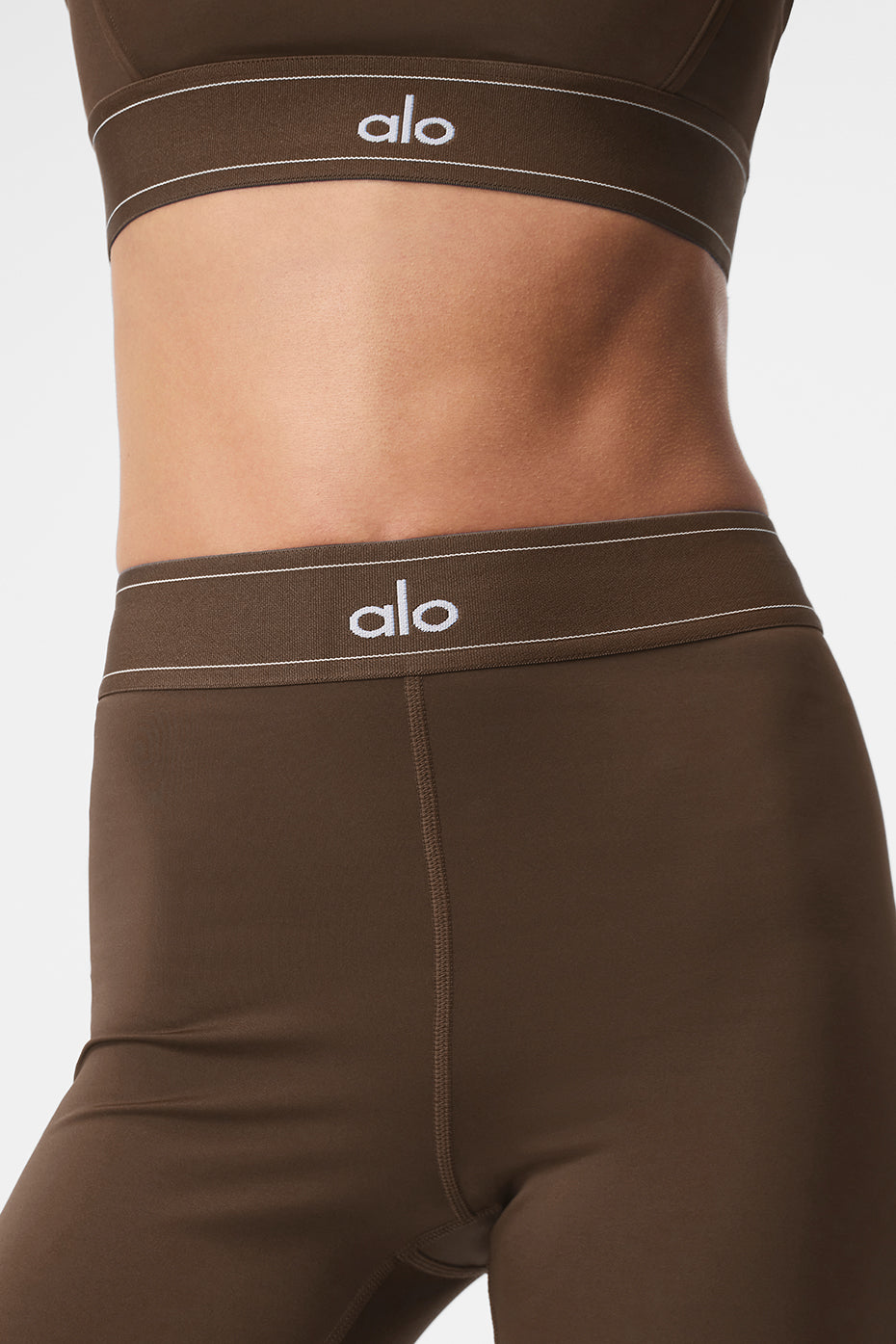 Back view highlighting the body-contouring design of the leggings.