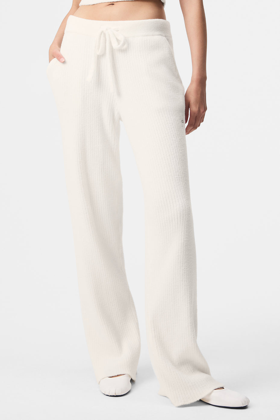 Ivory wide leg linen pants styled with a neutral tank top