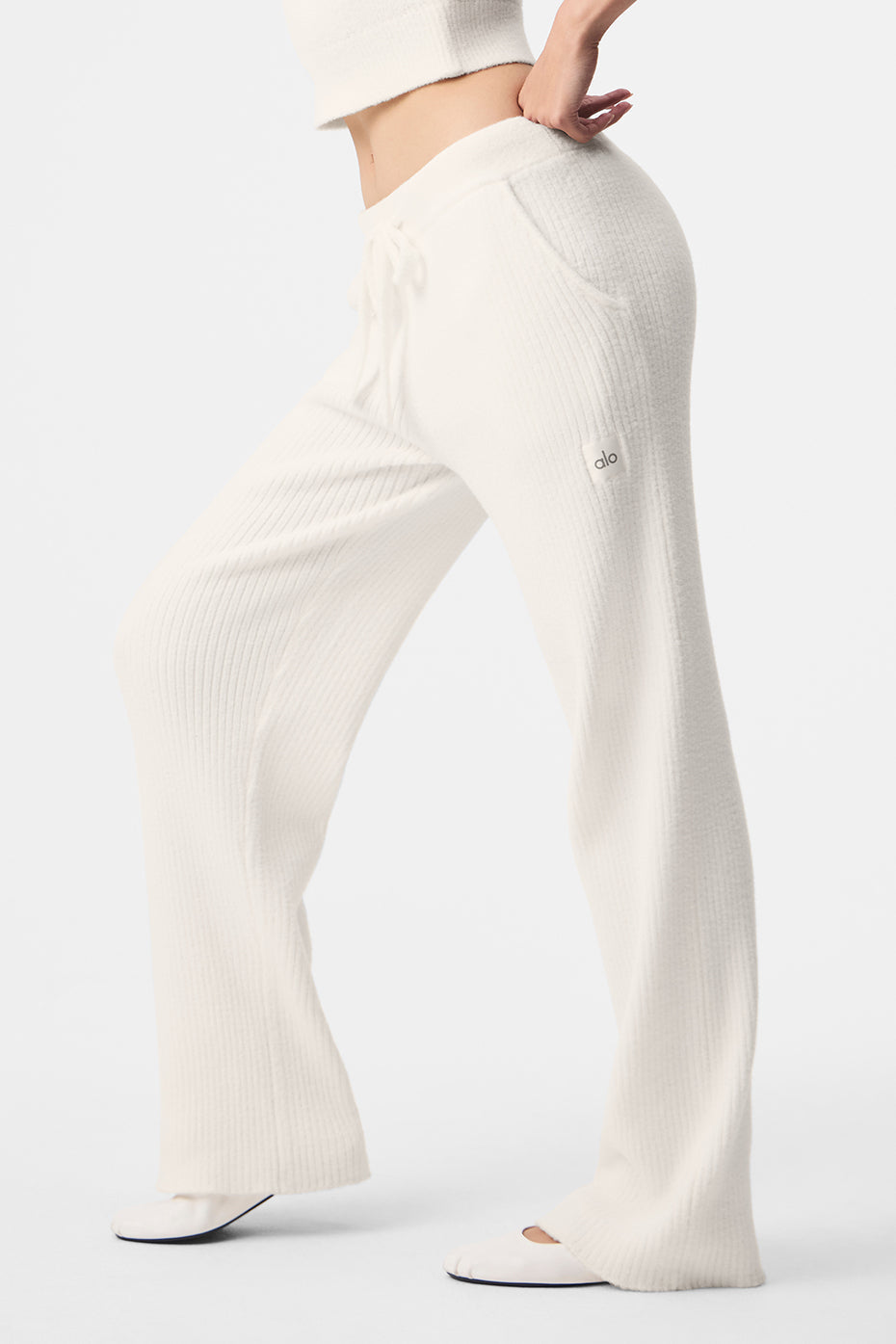 Ivory wide leg linen pants styled with a neutral tank top