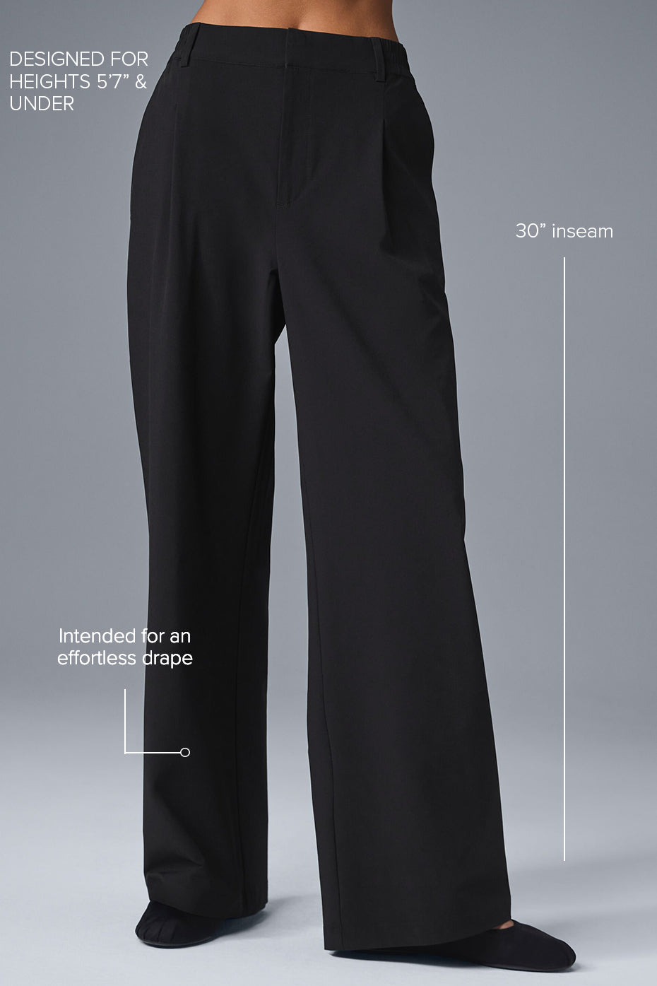 Model wearing high-waist trousers with a tucked-in sweater for workwear styling