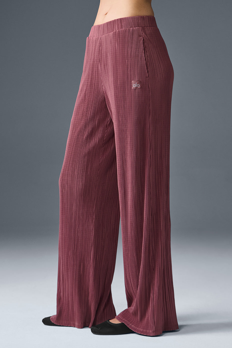 Close-up detail of the micro plisse texture on burgundy fabric