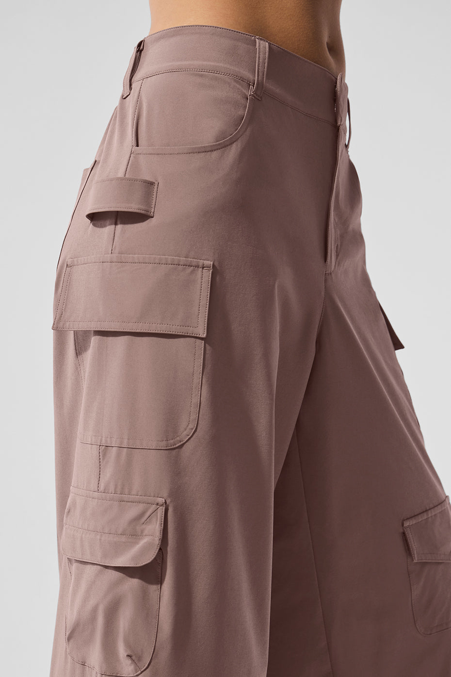 Close-up of the elastic-back waistband on mushroom cargo pants.