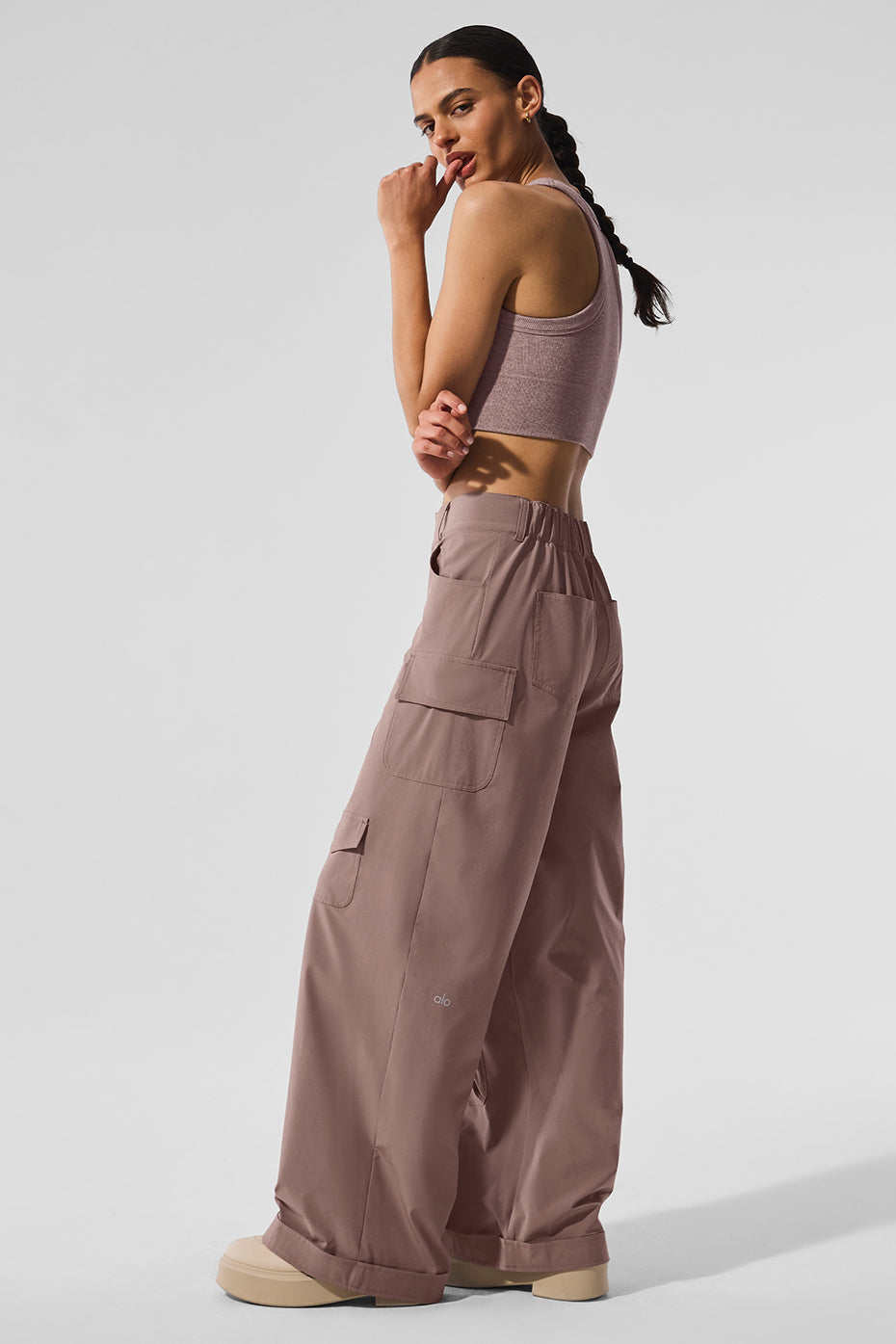 Mushroom cargo pants styled with casual footwear in an outdoor setting.