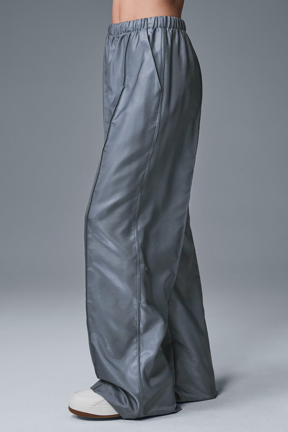 Laid-back look featuring chic athletic pants for women on a coastal morning