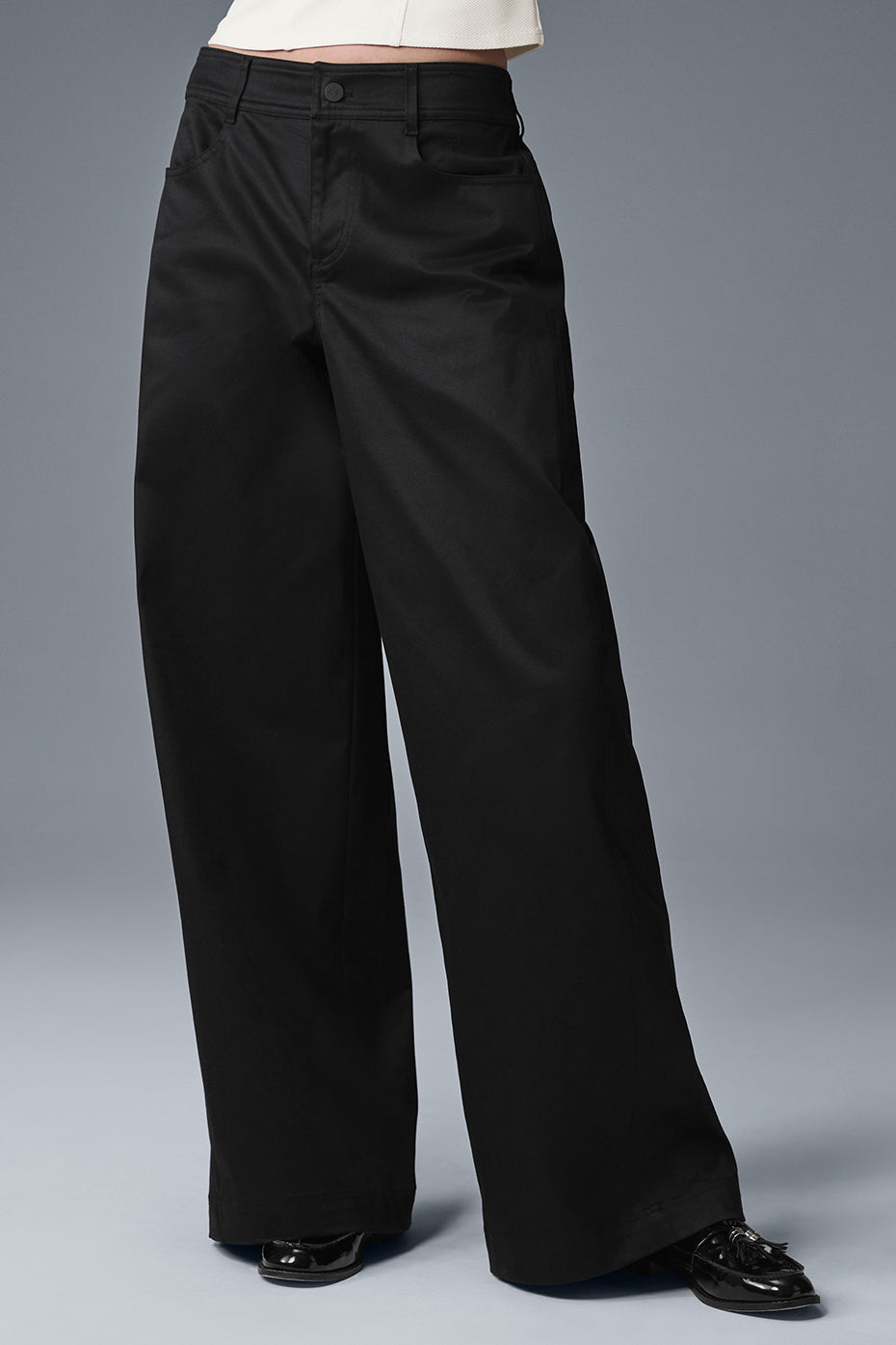 Front view of chic black wide-leg trousers for women.