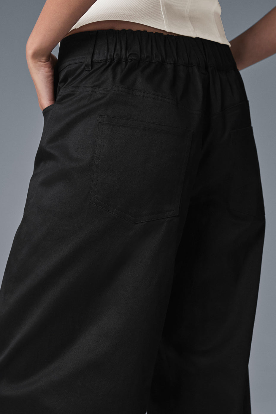 Front view of chic black wide-leg trousers for women.