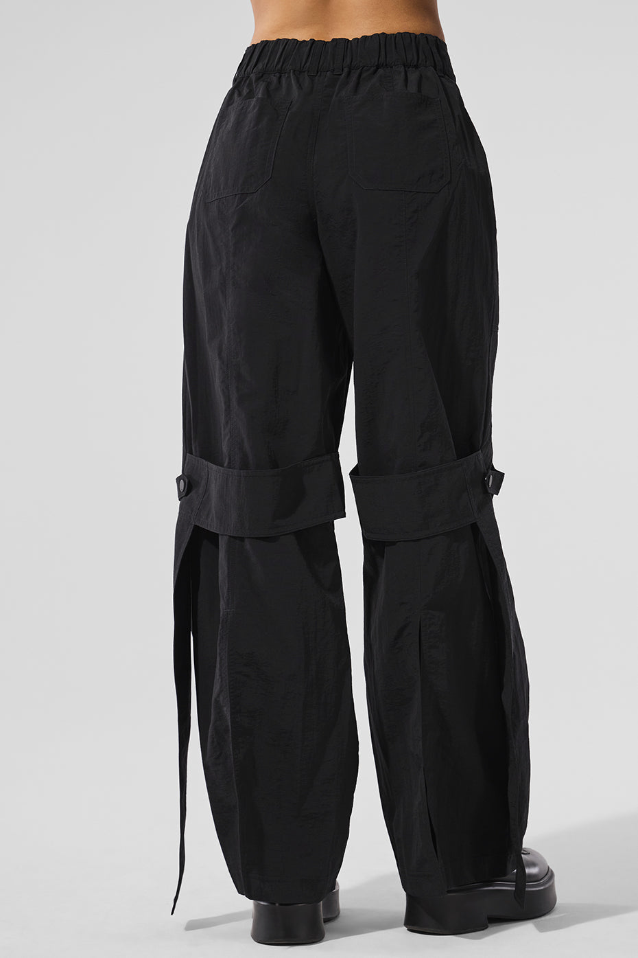 Stylish high waisted trousers worn with a cropped tee.