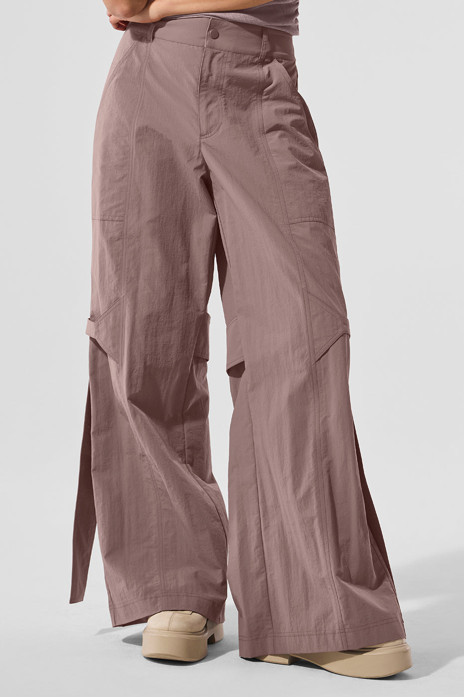 Front view of mushroom high-waist trousers for women, showcasing utility details.