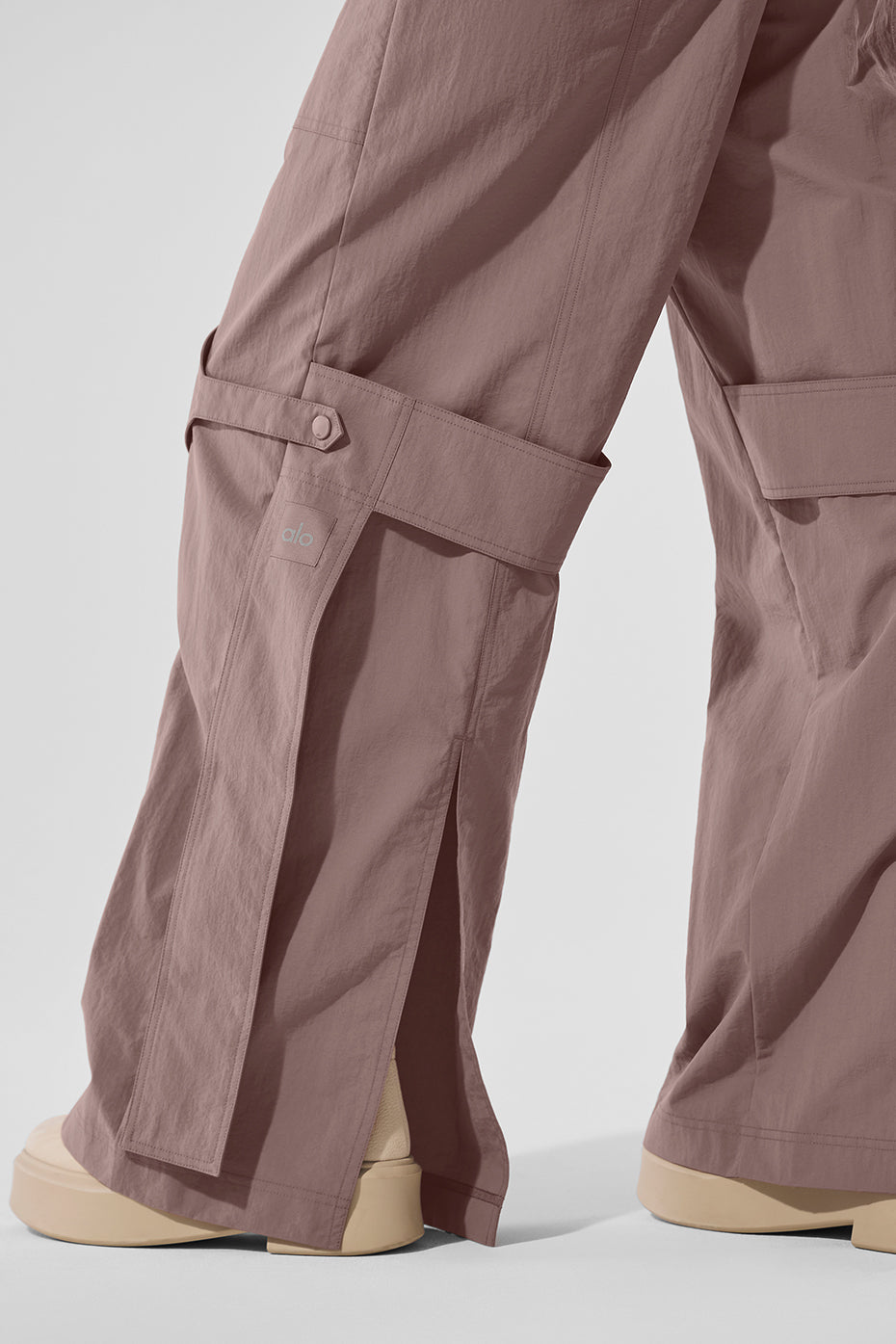 Front view of mushroom high-waist trousers for women, showcasing utility details.