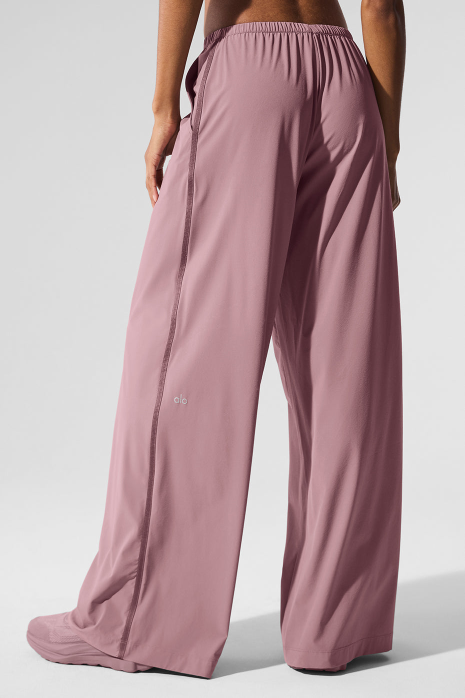 Travel pants folded neatly in suitcase showing packability
