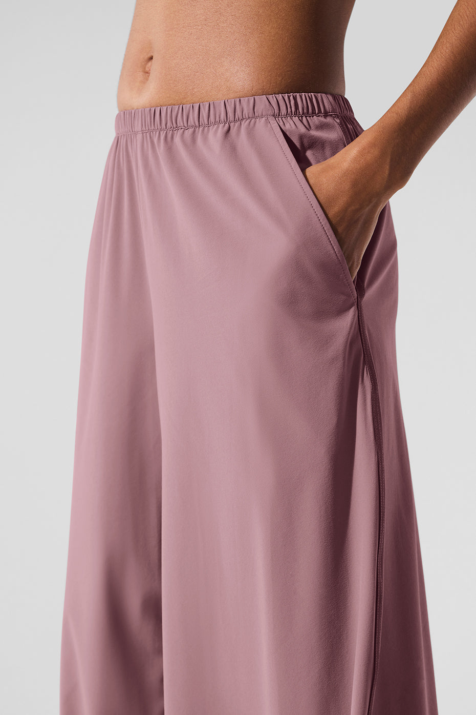 Front and back view of womens wide leg pants styled with white tee