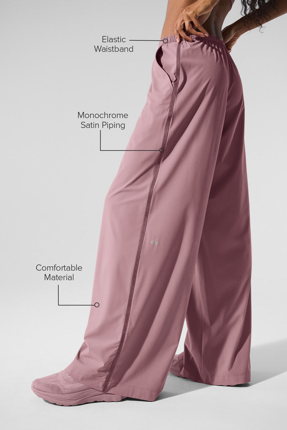Front and back view of womens wide leg pants styled with white tee