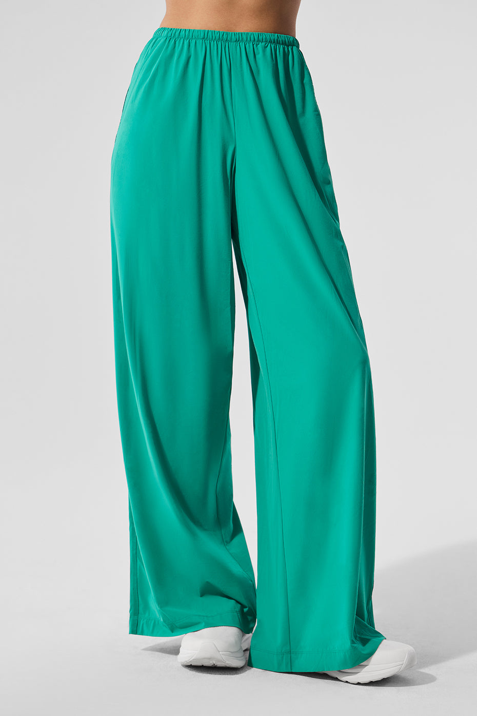 Casual outfit featuring wide leg linen pants paired with a cropped hoodie.
